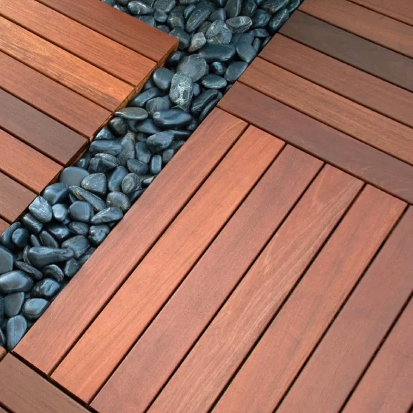 a ipe wood deck tiles with black rocks