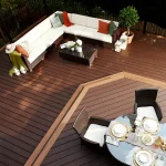 a composite decking trex lava rock with a table and chairs