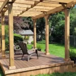 a TruNorth Enviroboard Mocha composite deck with deep mid-brown hue and natural hardwood grain with chairs on it