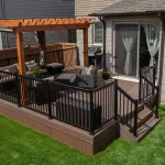 TruNorth Enviroboard Tropical Walnut composite deck with rich tropical brown tones and authentic grain texture with a patio and a pergola