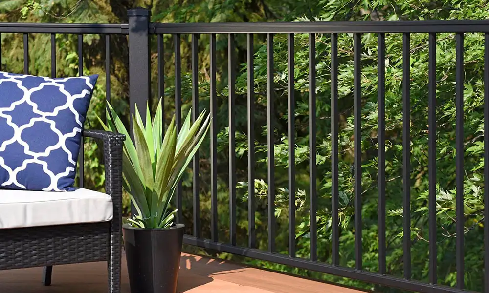 a plant in a pot on a deck with TimberTech IRX Railing